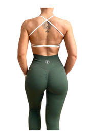 Skin2Skin Scrunch Collection - Khaki Green Scrunch Bum Leggings on a woman with a tattoo, showcasing sculpted fit and ruched design.