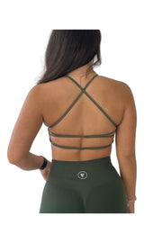 Elite Collection - Cross Back Sports Bra in Khaki, a woman in a green outfit showcasing the high support design for active lifestyles.