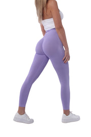 Woman wearing Nakd Scrunch Collection - Scrunch Bum Gym Leggings, showcasing tight fit and stylish design for workouts.