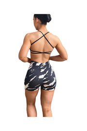 A woman in Wild Collection Scrunch Bum Gym Shorts in Black Zebra, offering curve control and moisture-wicking fabric for a stylish and comfortable workout. Sizes: Small (6-8), Medium (10-12), Large (12-14).
